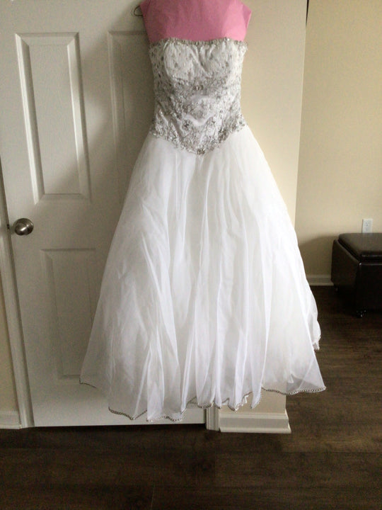 Carolina Herrera Strapless beaded top ball gown with detachable train and veil