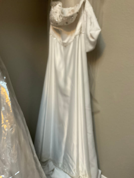 Julie Vino Correct designer is Jun Ricaforte. Strapless, rests above breast